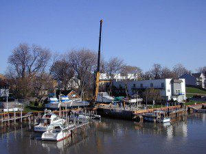 Crane lowering boat into Kenosha, Wisconsin's small boat harbor