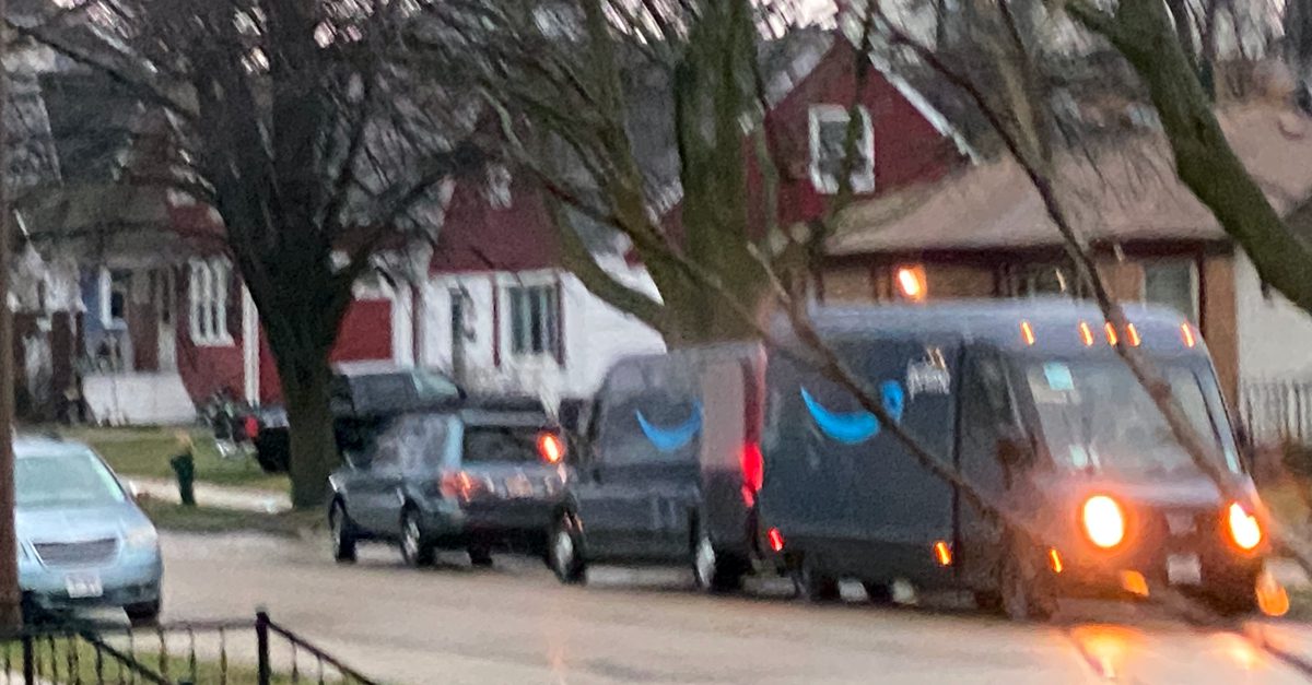 Amazon vans mating on Webster St. in Racine, Wisconsin, April 4, 2023
