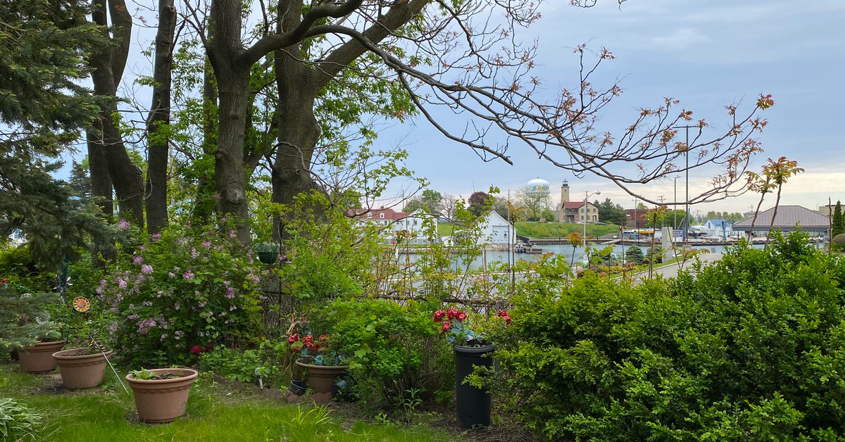 View of Kenosha, Wisconsin's harbor from 6th Avenue through a side yard.