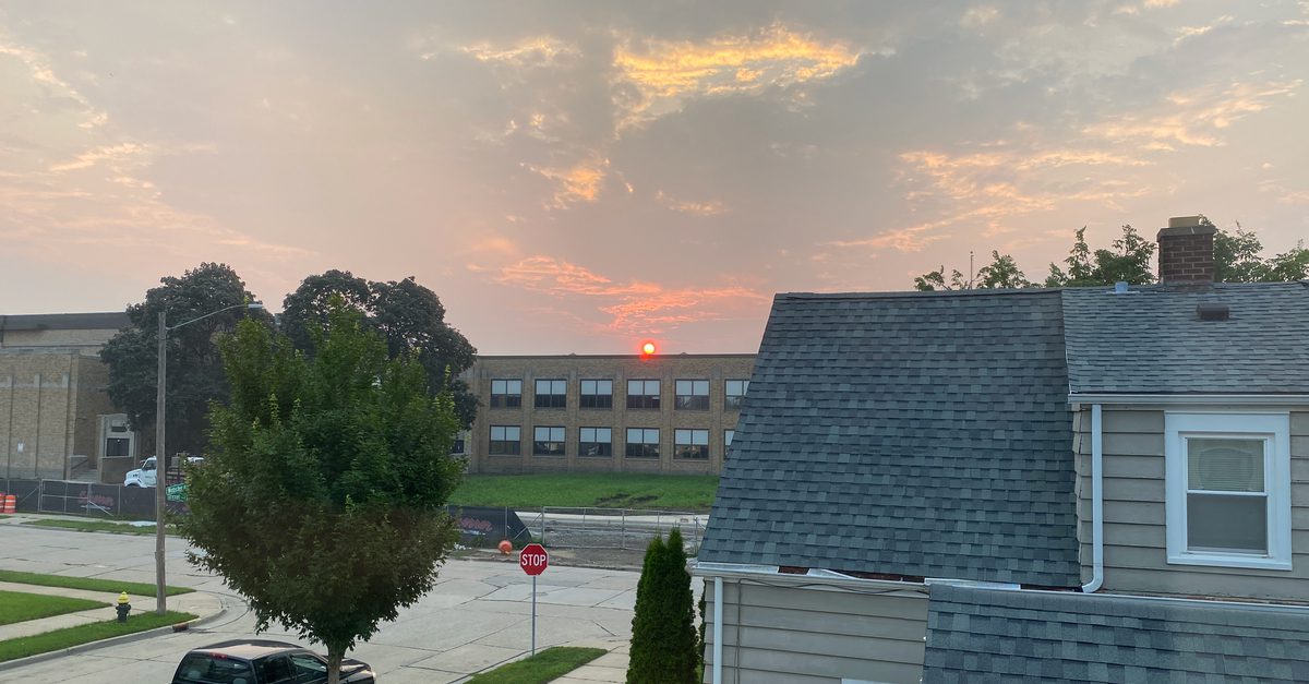 Sunrise through Canadian wildfire smoke at Mitchell School in Racine, Wisconsin.