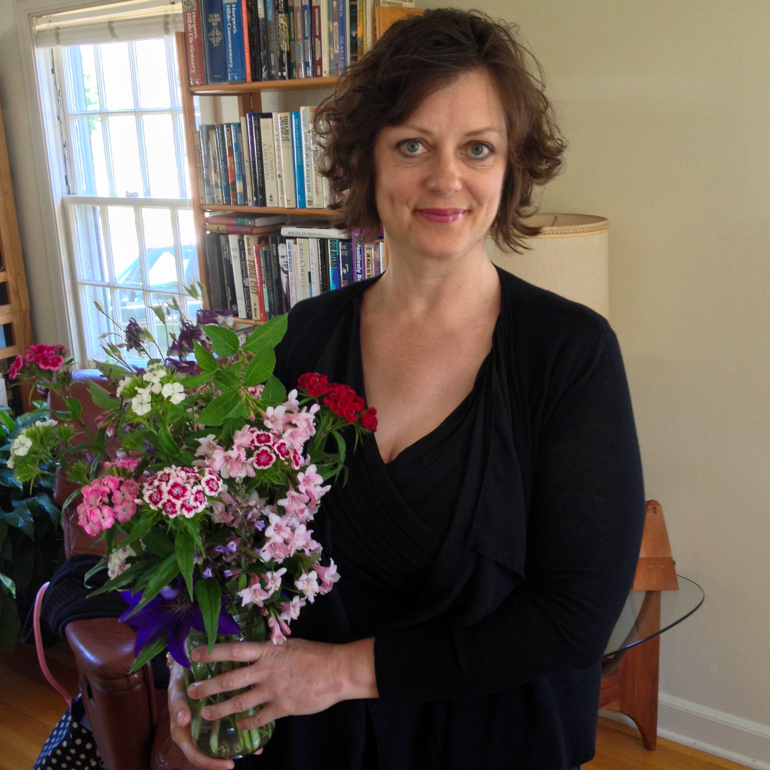 Amy Czerniec, at home with bouquet of flowers