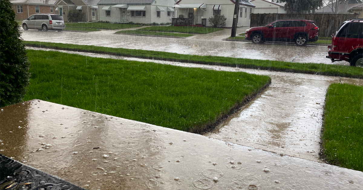 Hail falling on doorstep during storm on Webster St in Racine, Wisconsin, April 21, 2006