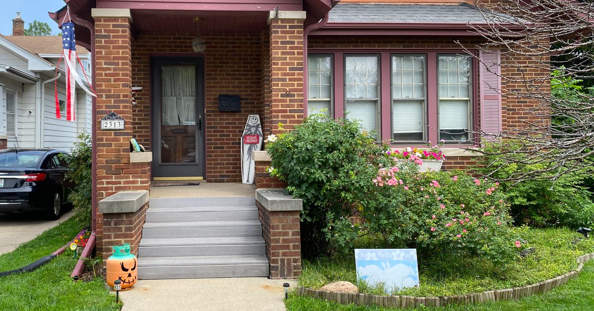House in Racine, WI displaying July 4, Halloween, and Mother's Day decorations.